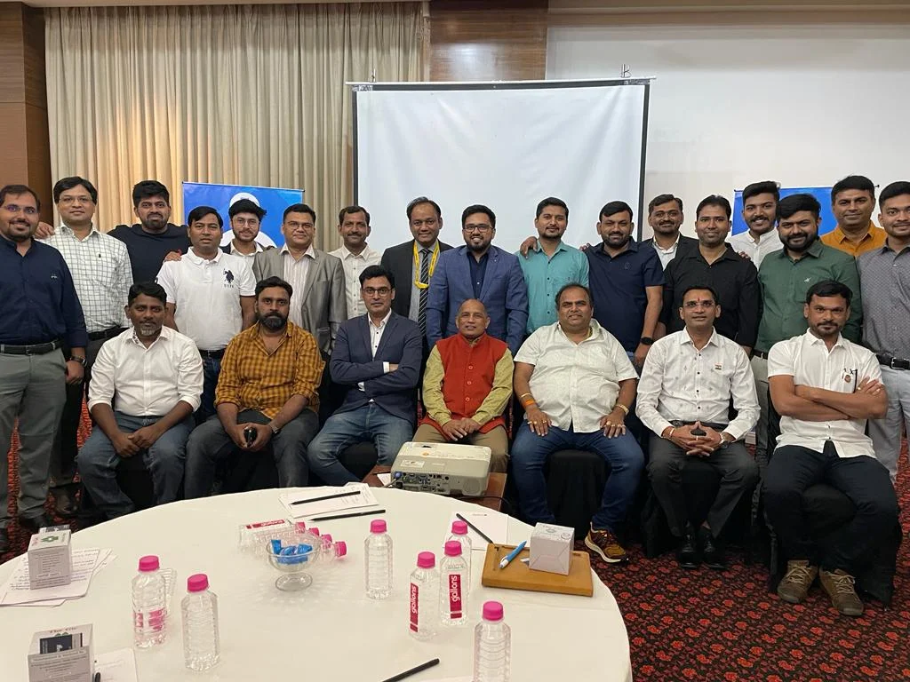 NCE members gathered at an indoor community meeting